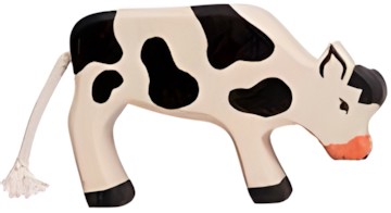 Holztiger Kalb grasend schwarz